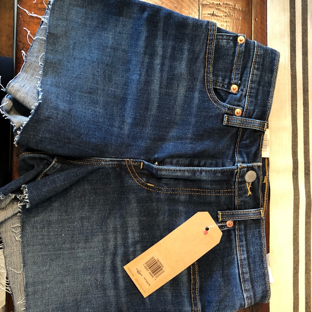 High rise Levi shorts. Dark wash. New with tags